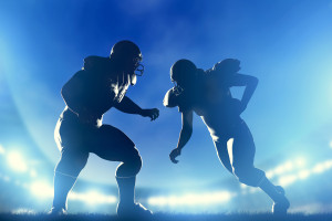 American football players in game, quarterback running. Night st